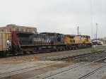 SP 343  1Apr2011  EB with empty coal cars approaching the yard office 